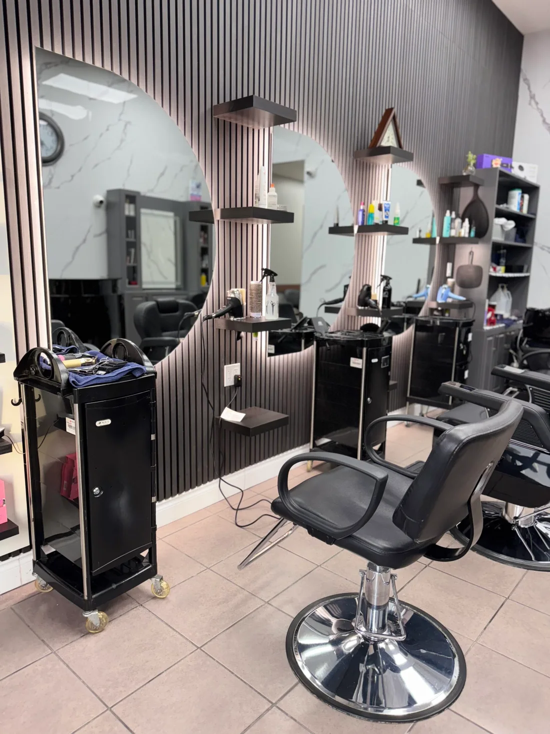 Styling stations beneath pendant lights at 7 Heaven